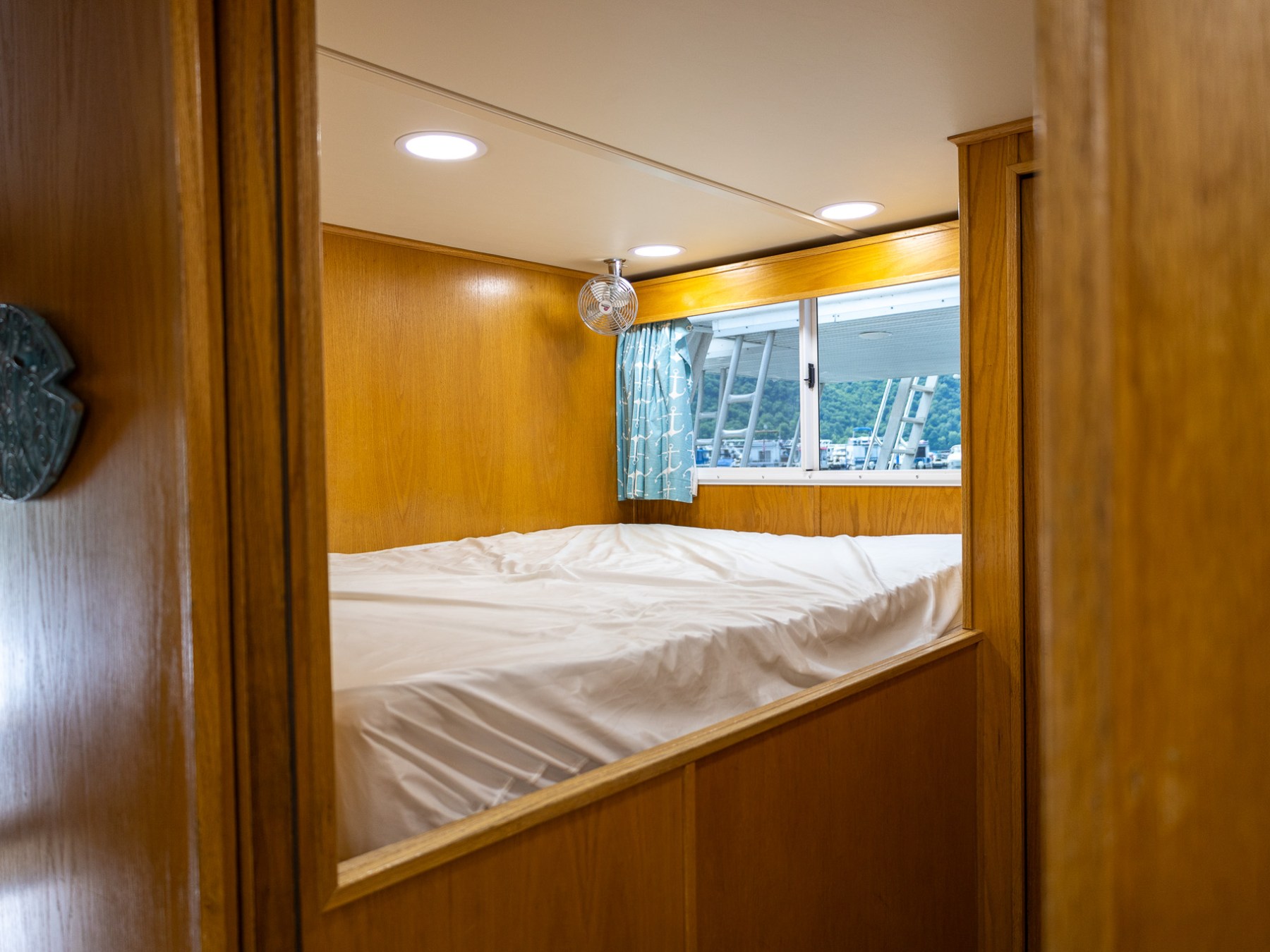 a bedroom with a bed and a mirror