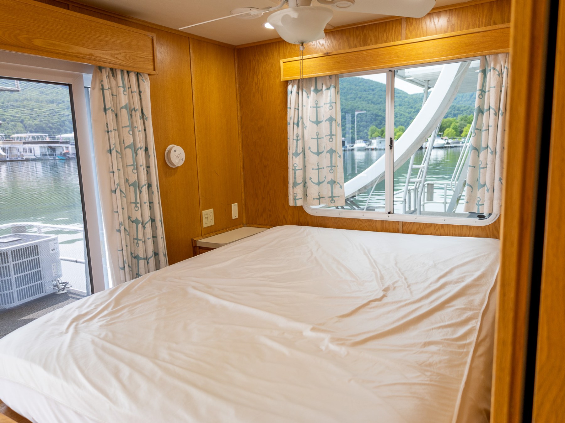 a bedroom with a bed and a window