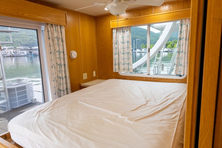 a bedroom with a bed and a window