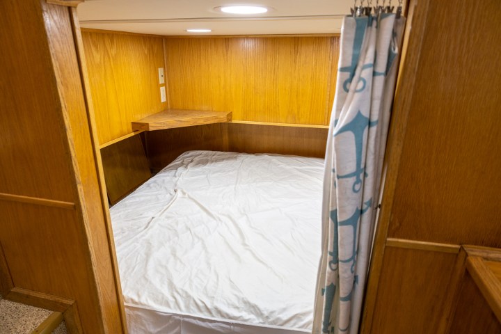 a bedroom with a bed and a mirror