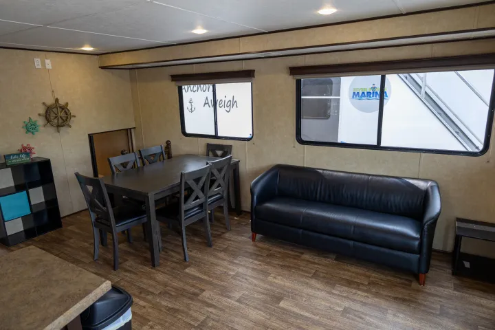 a living room filled with furniture and a flat screen tv