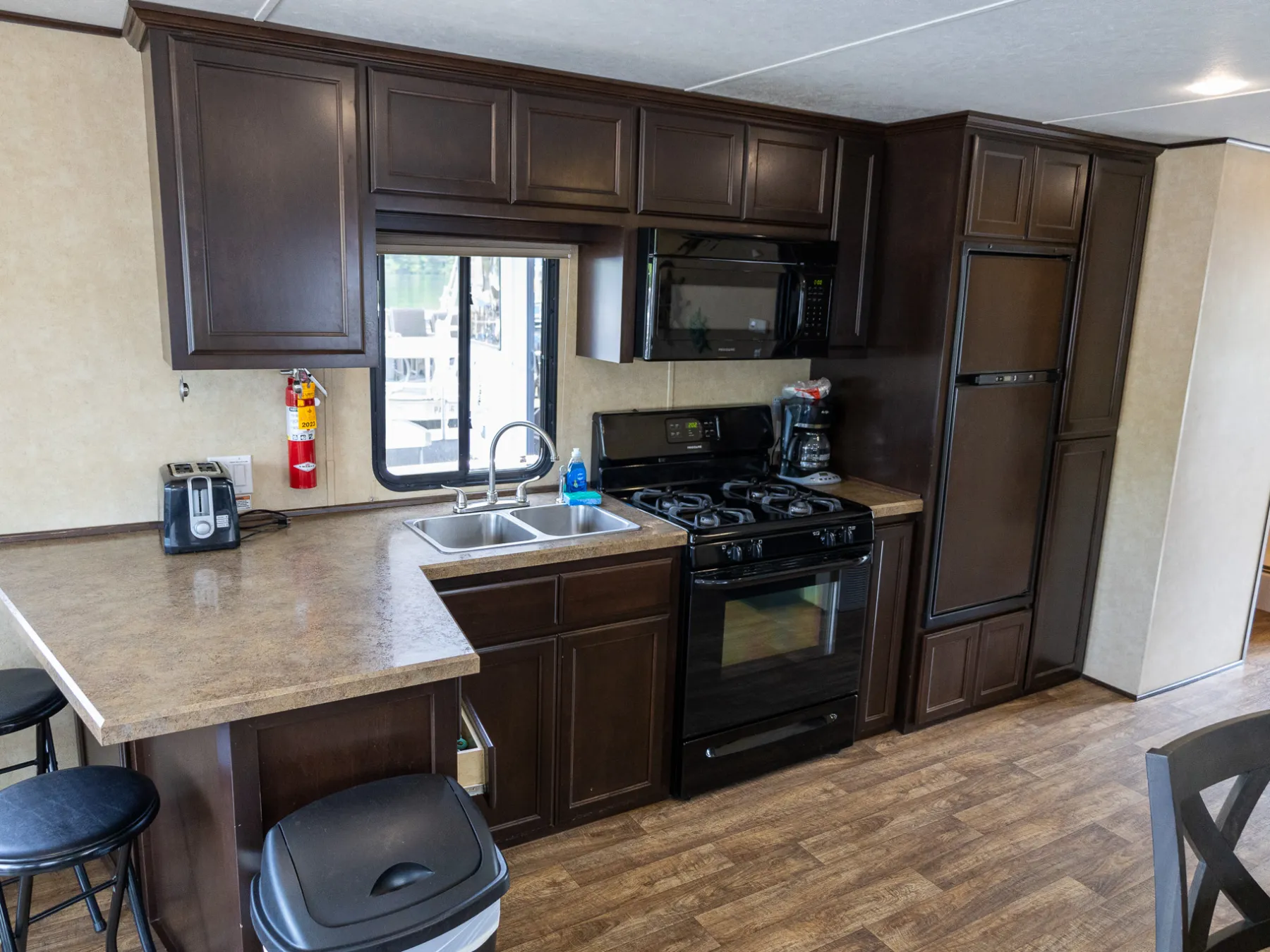 a kitchen with a stove top oven sitting inside of a room