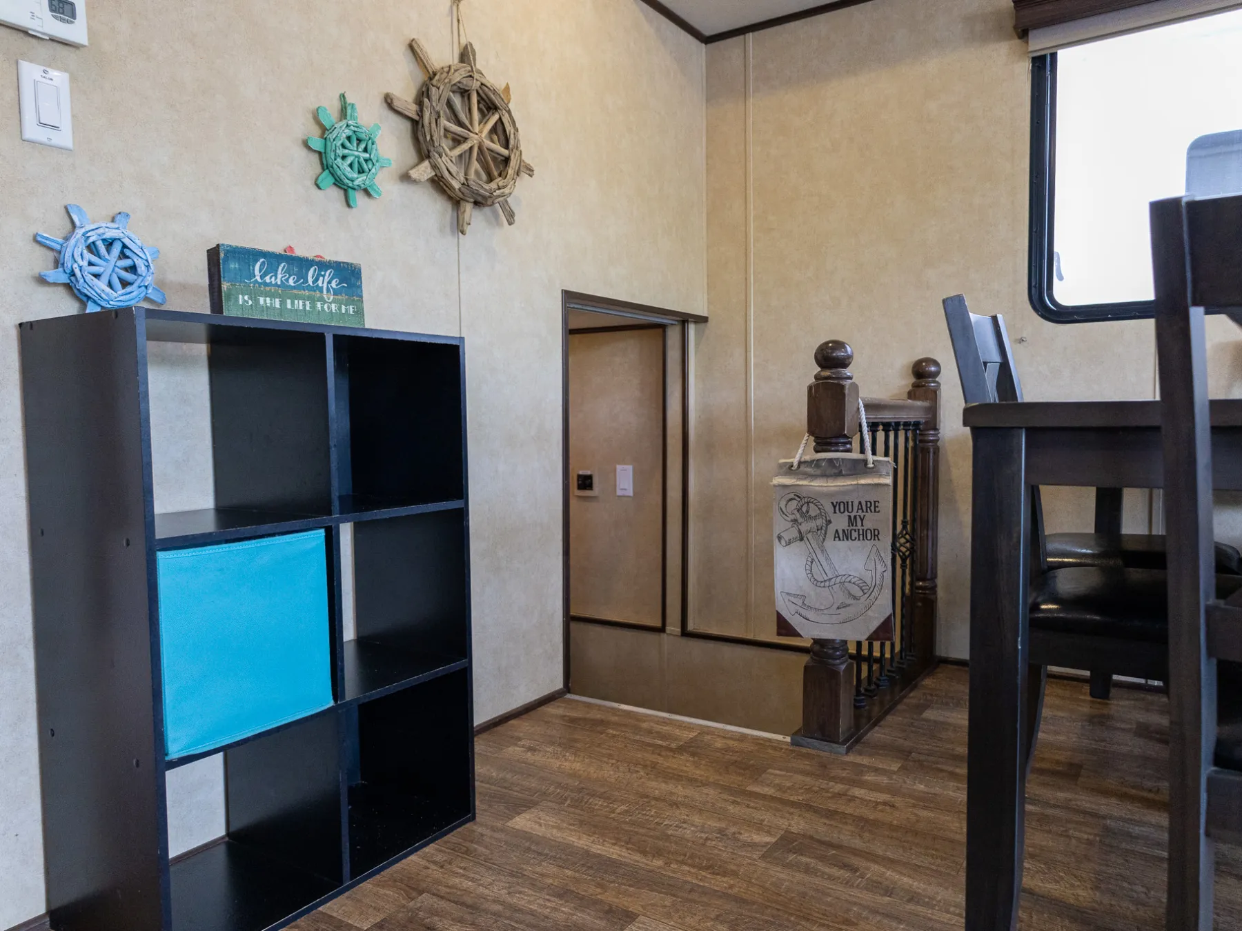 a kitchen with a blue chair