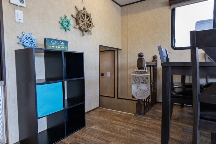 a kitchen with a blue chair