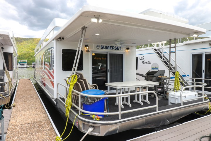 a train is parked on the side of a building