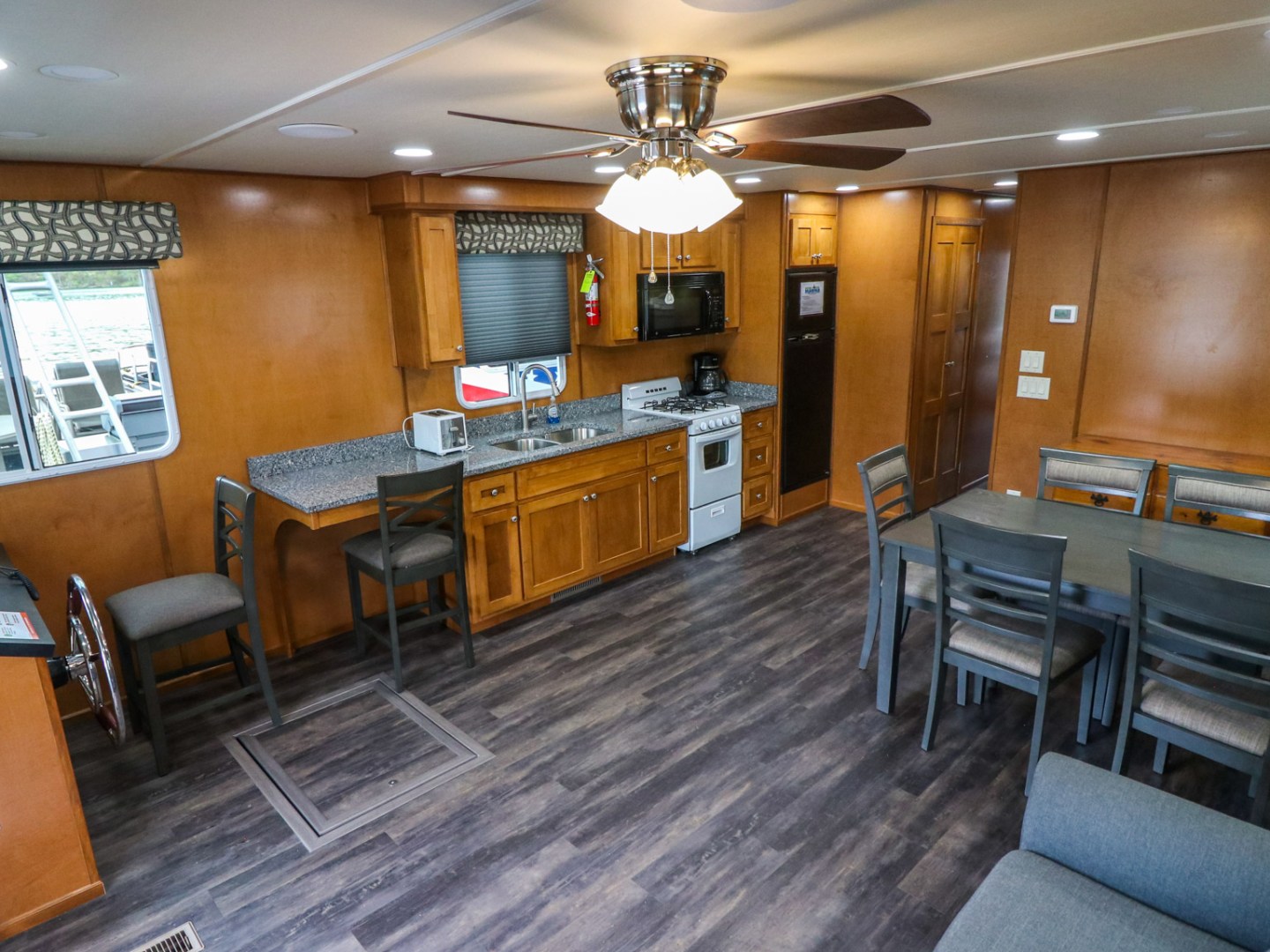 a room filled with furniture on top of a wooden table