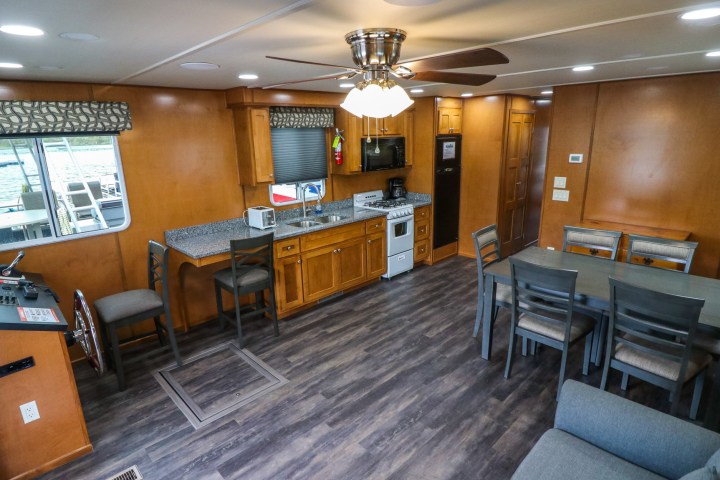 a room filled with furniture on top of a wooden table