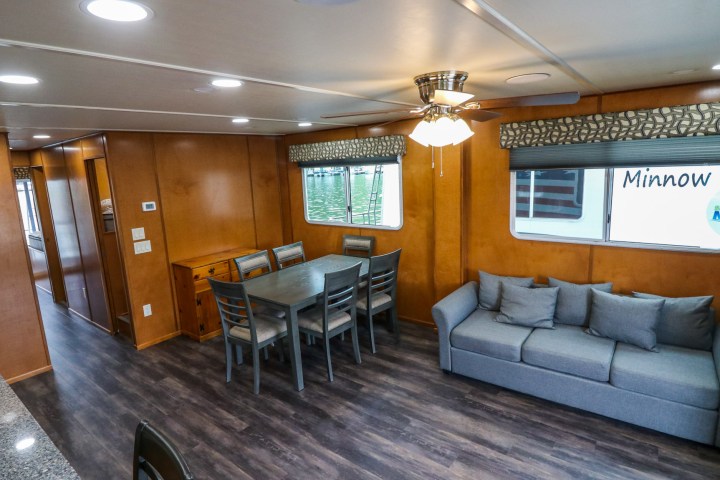 a living room filled with furniture and a large window