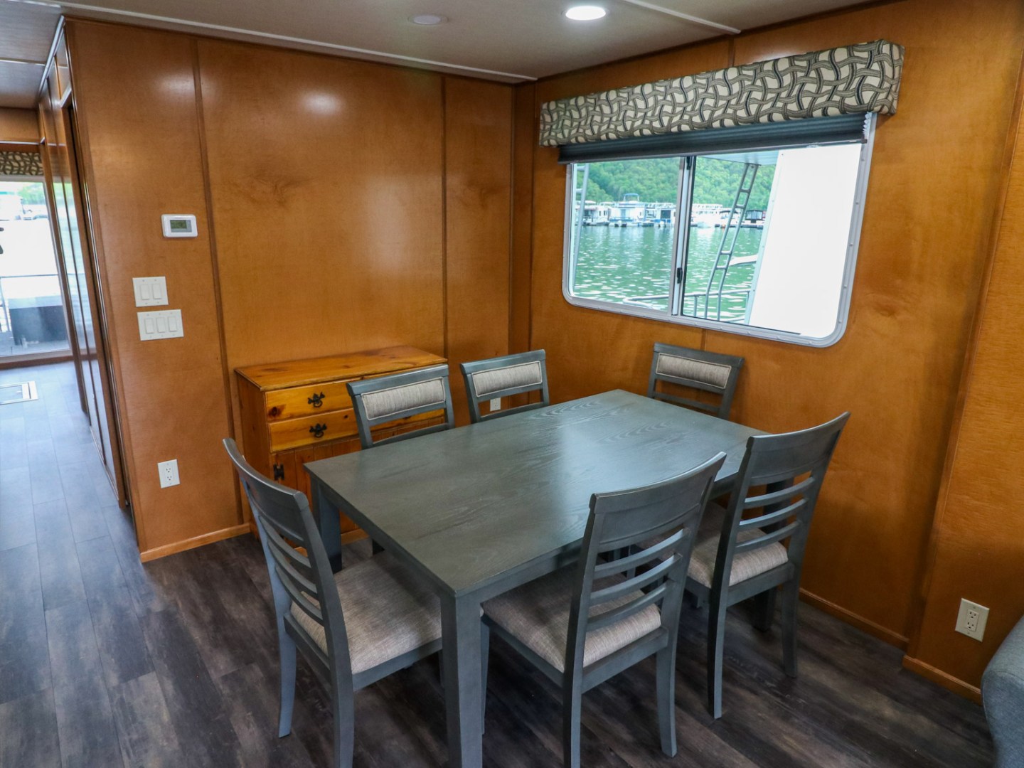 a dining room table in front of a window