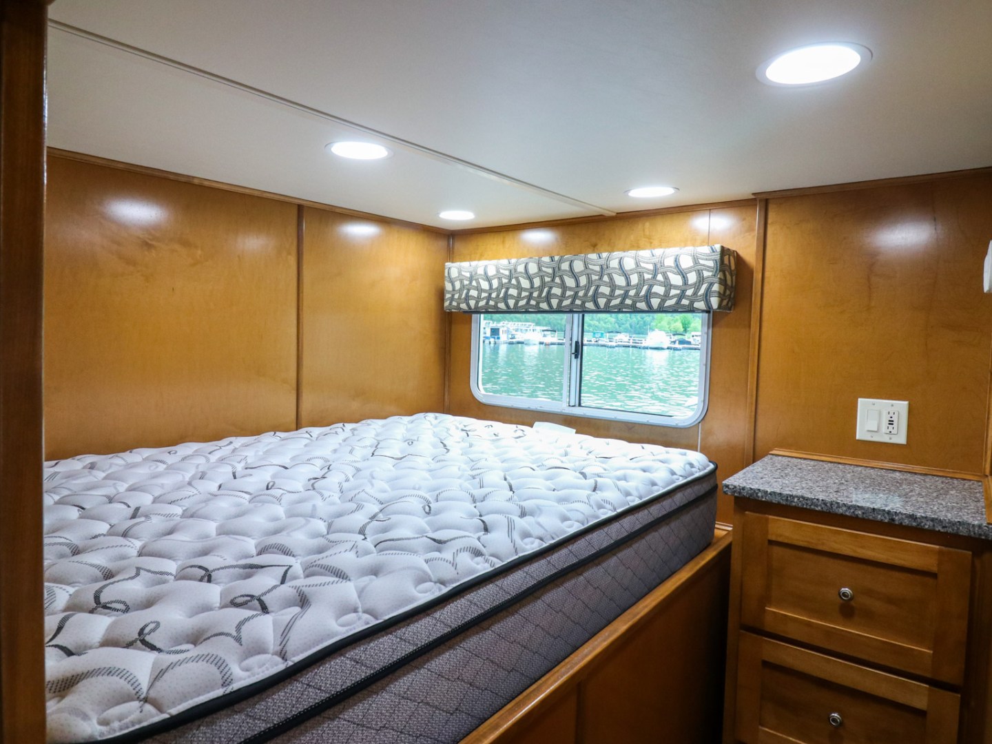 a bedroom with a bed and a mirror