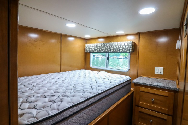 a bedroom with a bed and a mirror