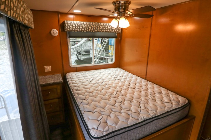 a bedroom with a large window