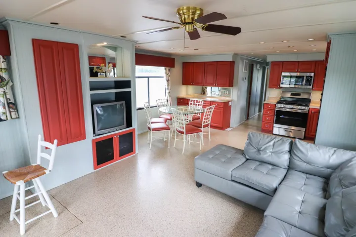 a living room filled with furniture and a tv