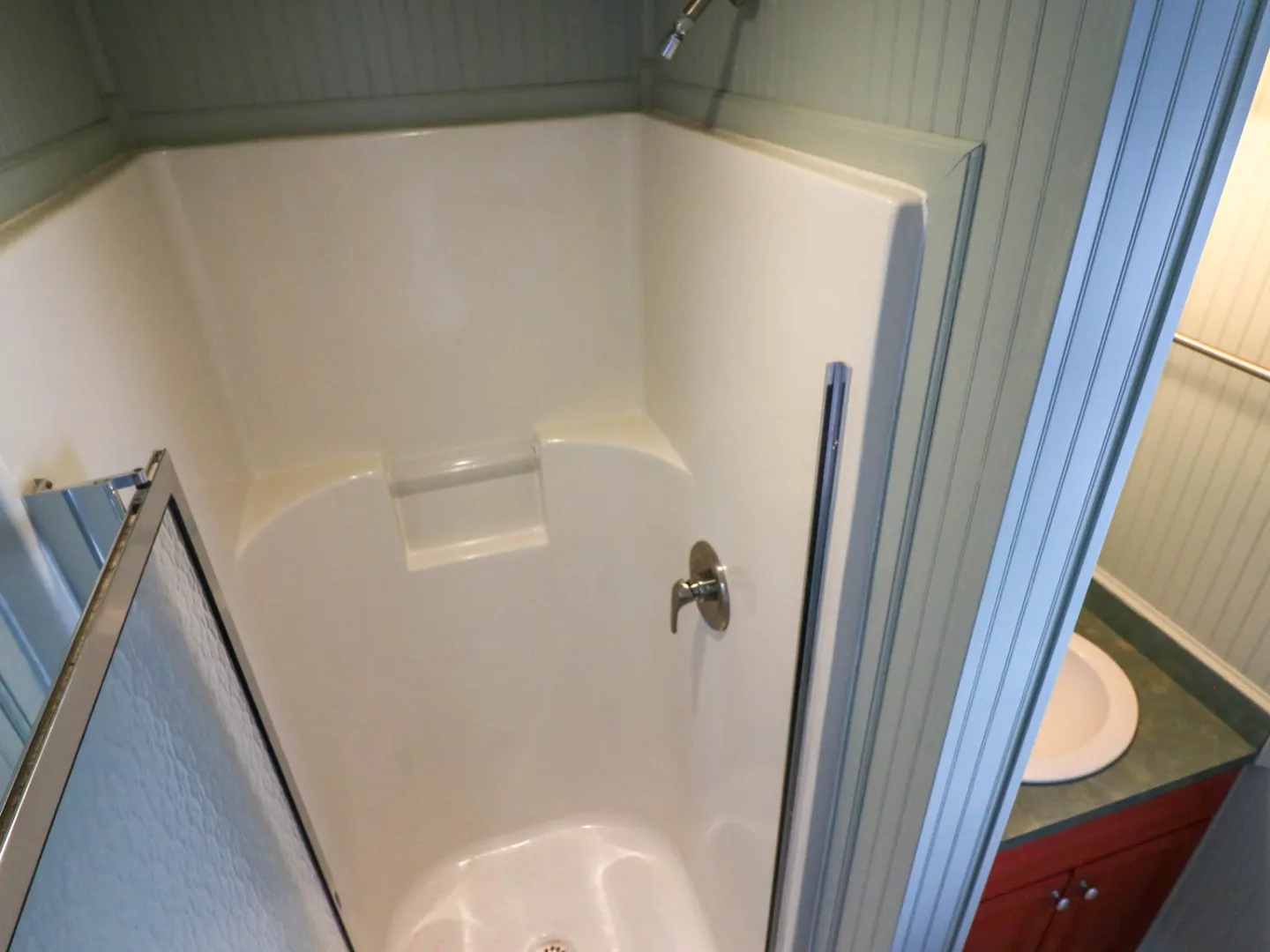 a close up of a shower in a small room