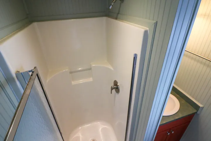 a close up of a shower in a small room