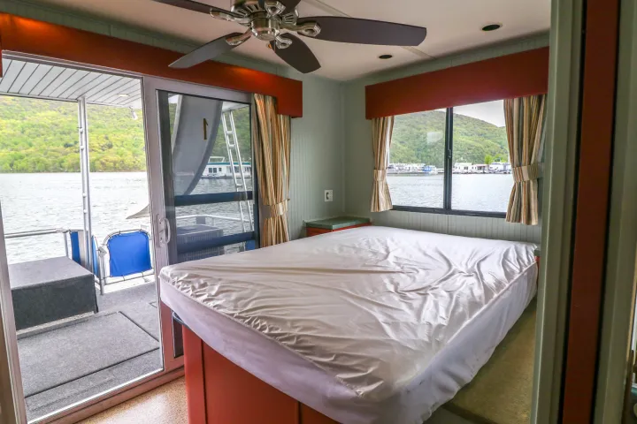 a bedroom with a bed and a window