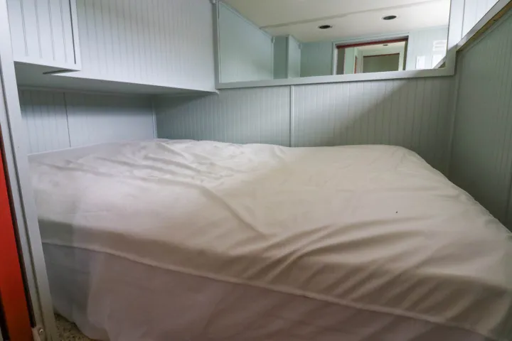a bedroom with a bed in a room