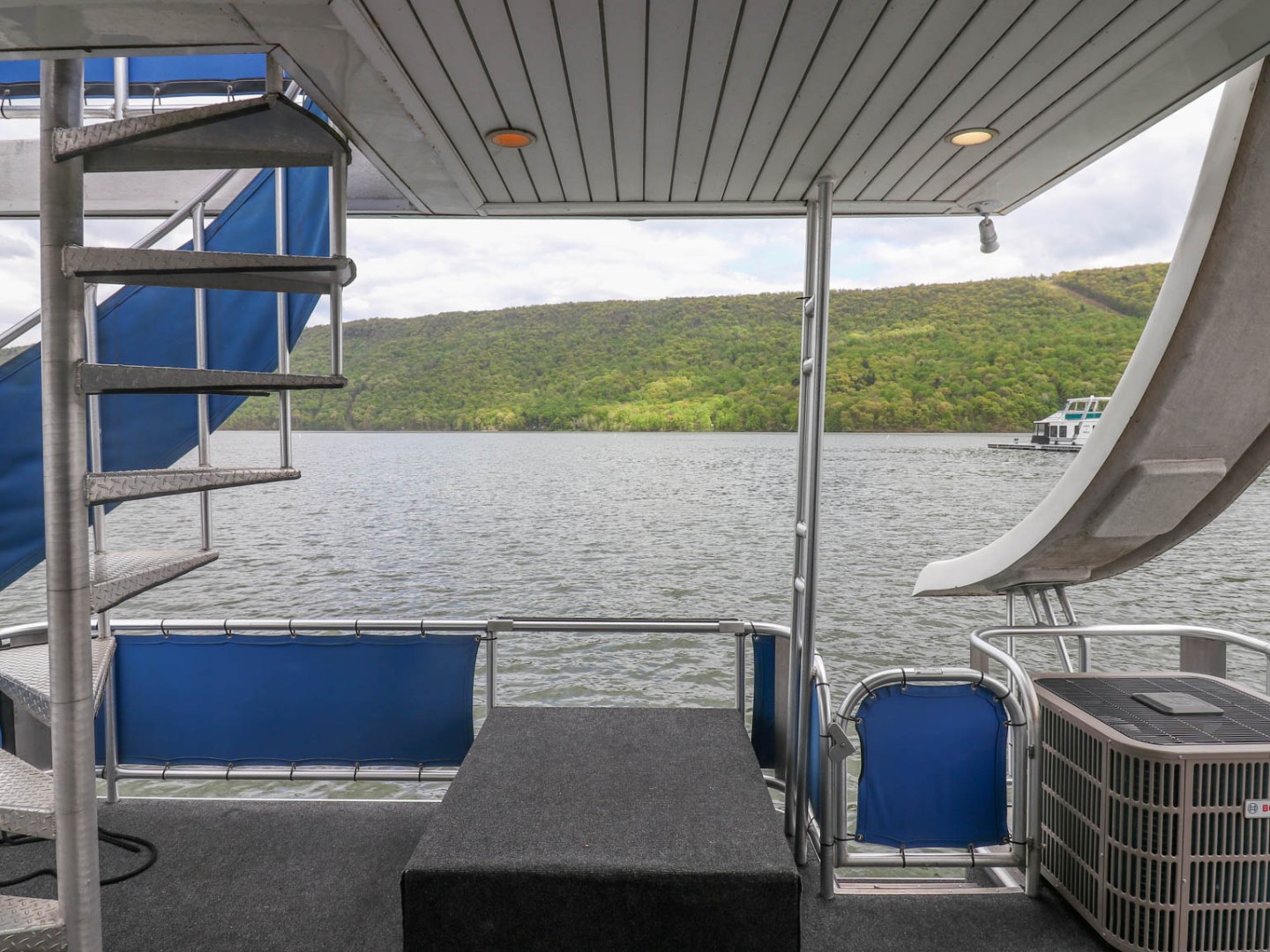 a chair with a blue umbrella