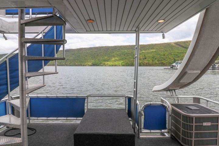 a chair with a blue umbrella