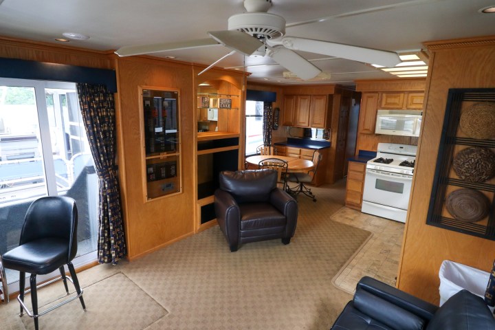 a living room filled with furniture and a large window