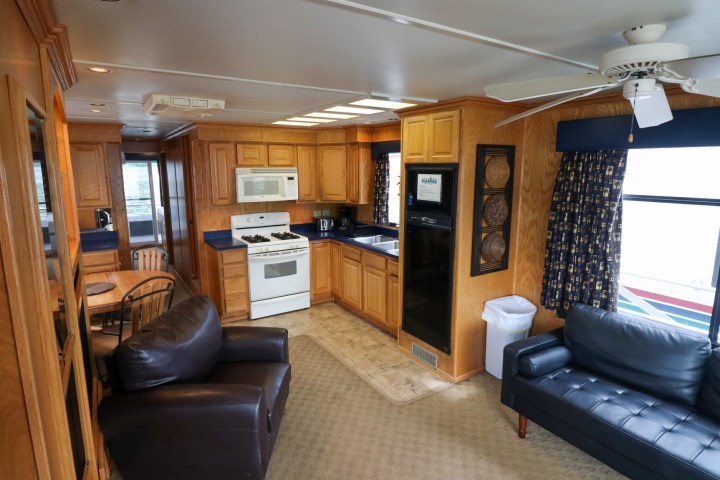 a living room filled with furniture and a flat screen tv