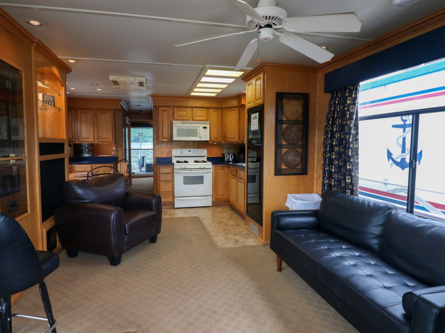 a living room filled with furniture and a large window