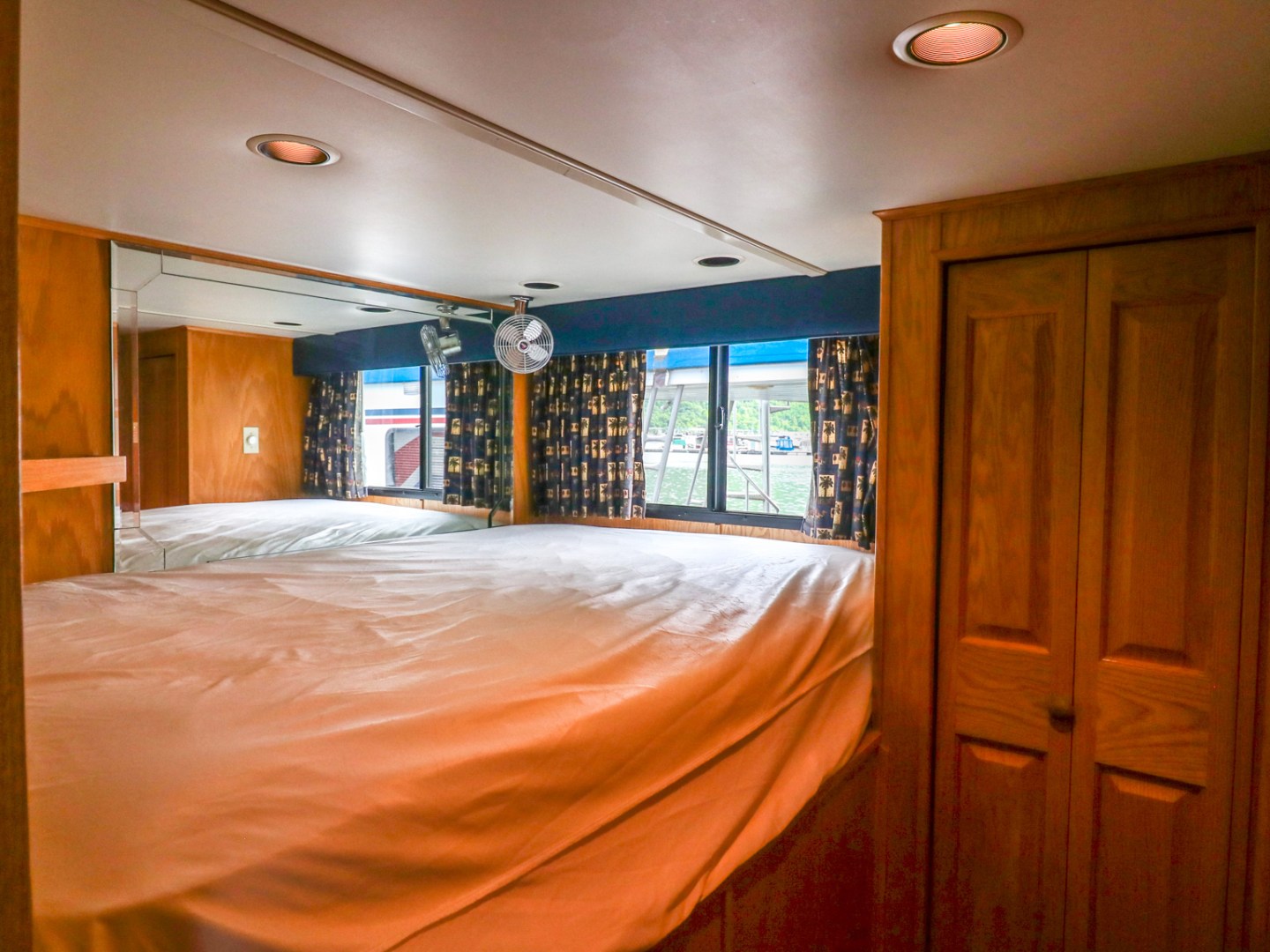 a bedroom with a bed and a mirror