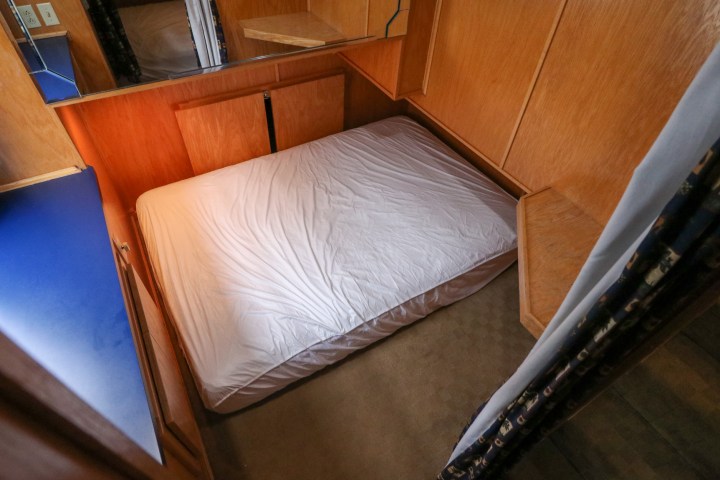 a bed with a wooden table