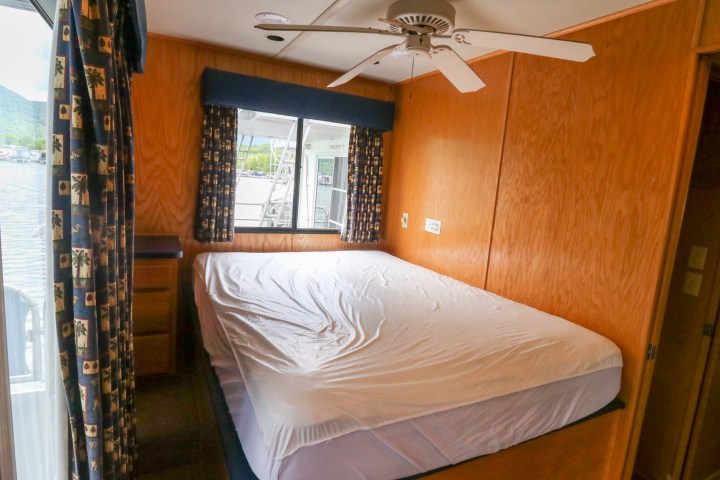 a bedroom with a bed in a room