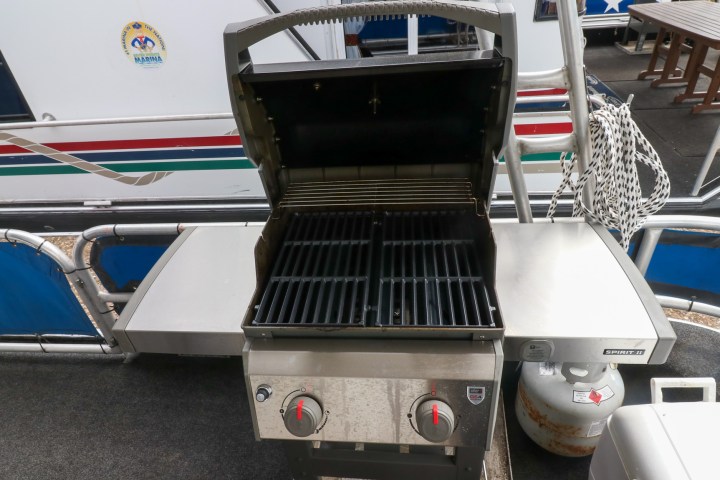 a stove top oven sitting inside of a car
