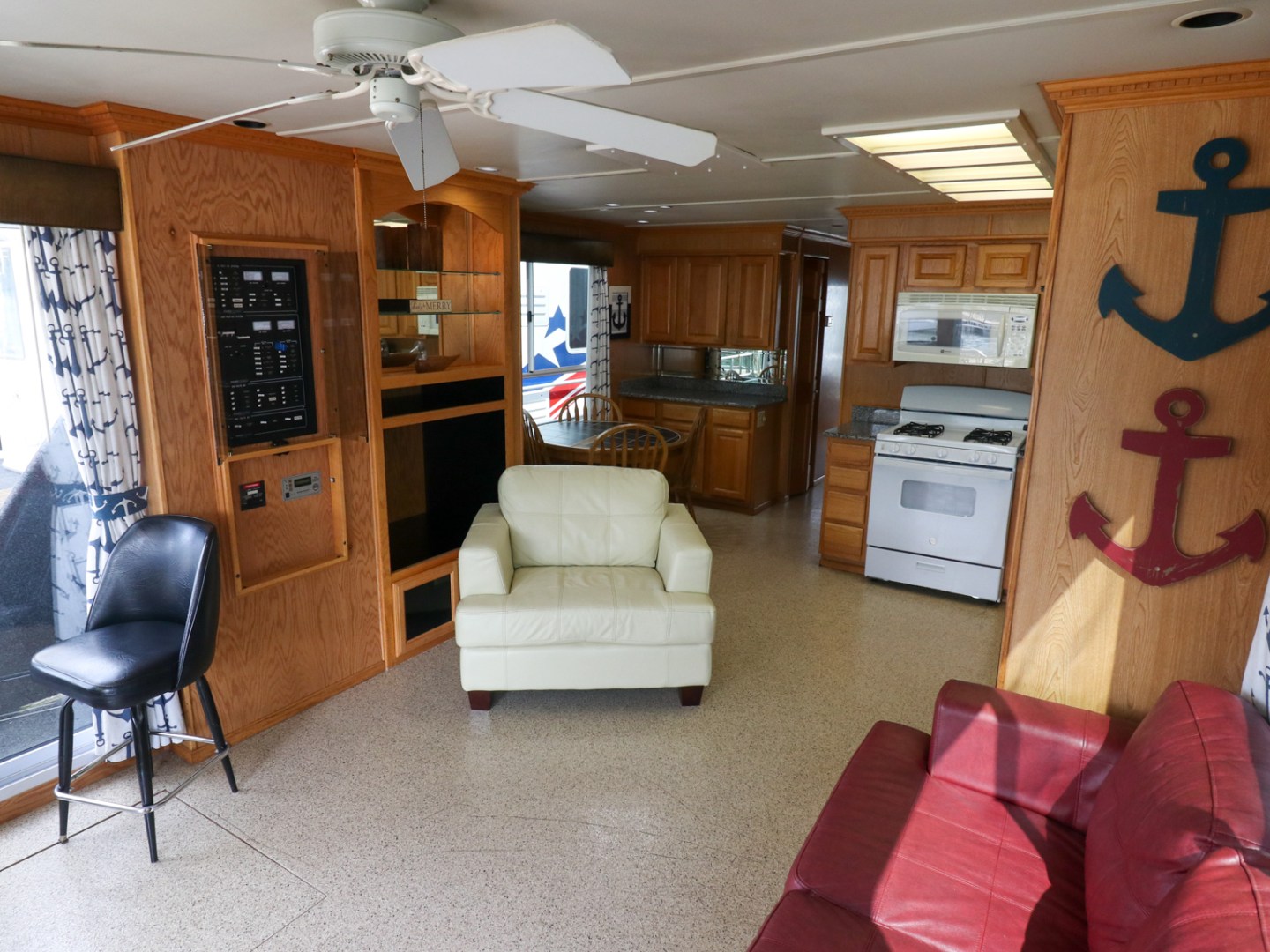 a living room filled with furniture and a tv