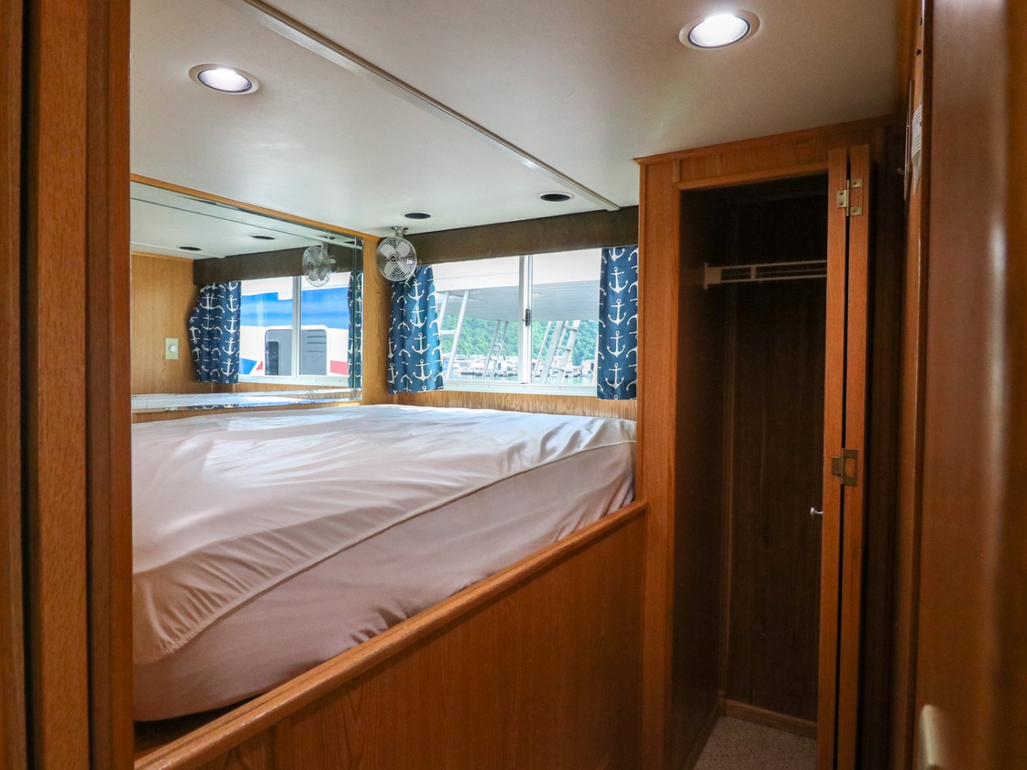 a bedroom with a bed and a mirror