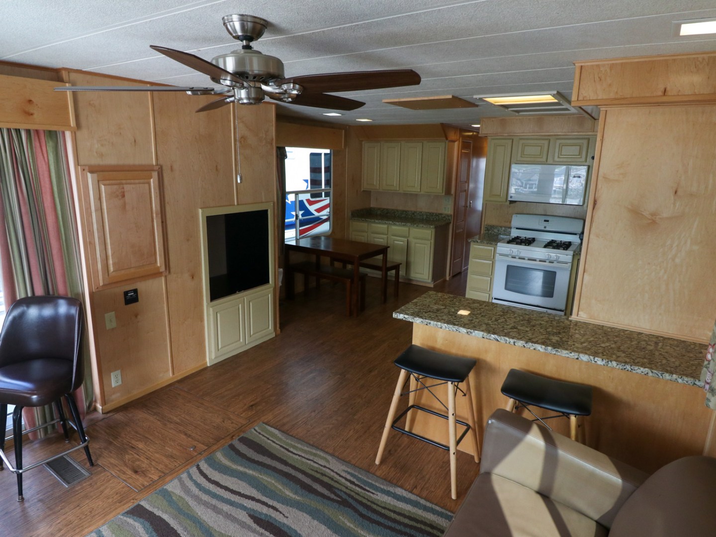 a living room filled with furniture and a tv