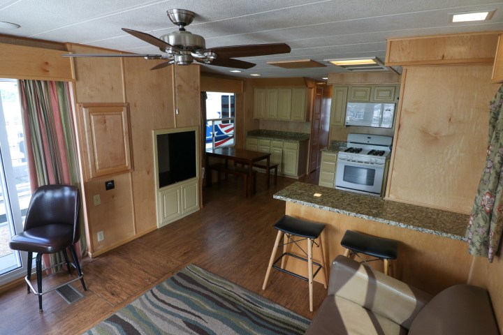 a living room filled with furniture and a tv