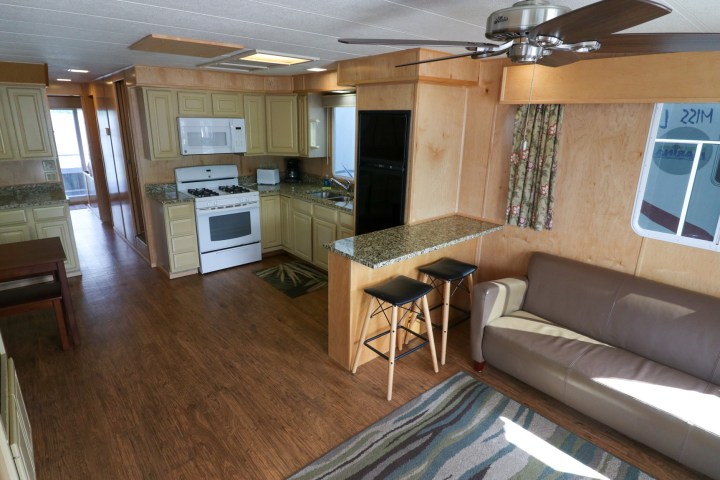 a living room filled with furniture and a large window