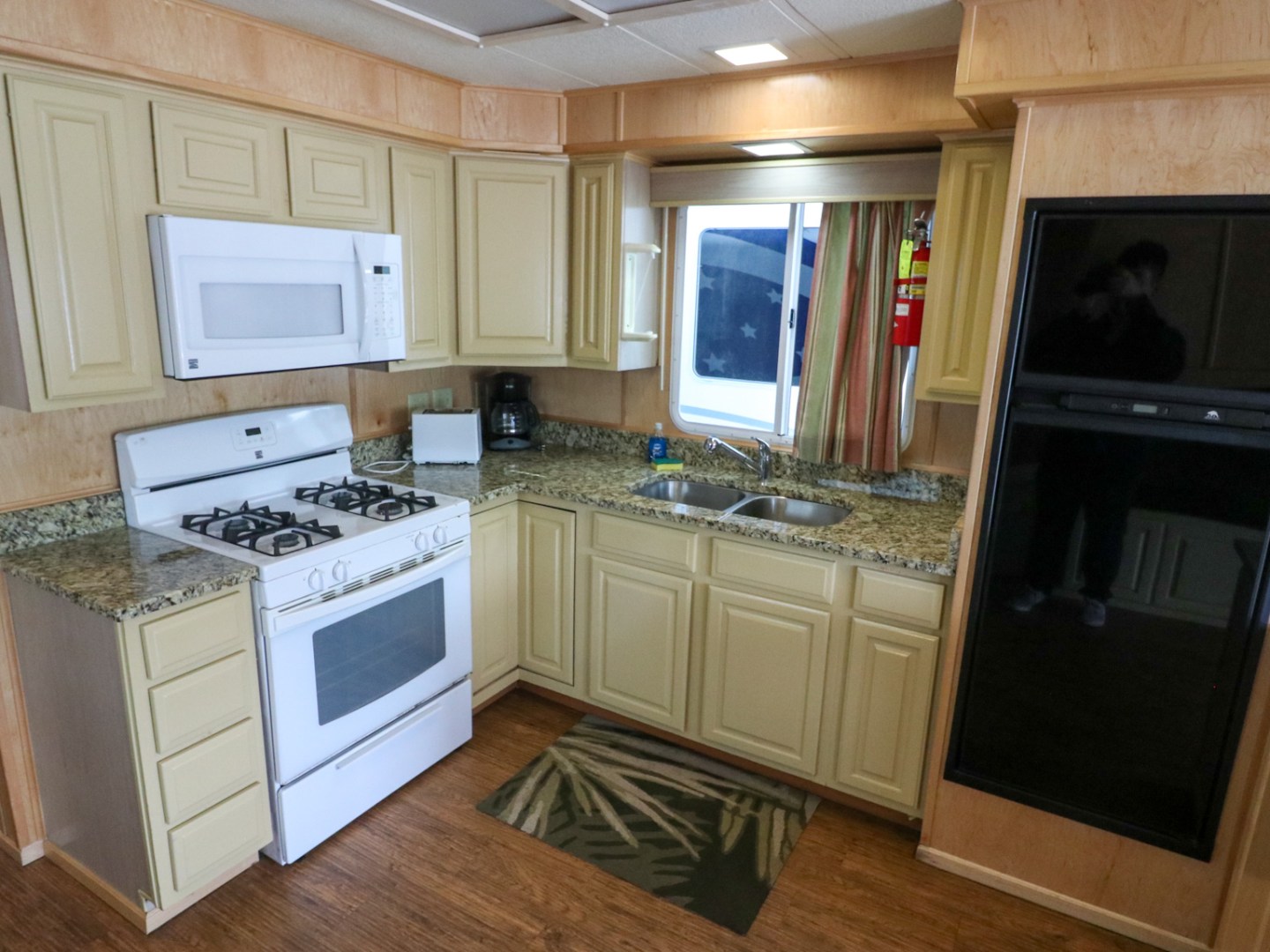a kitchen with a sink and a microwave