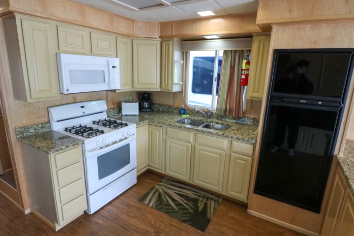 a kitchen with a sink and a microwave