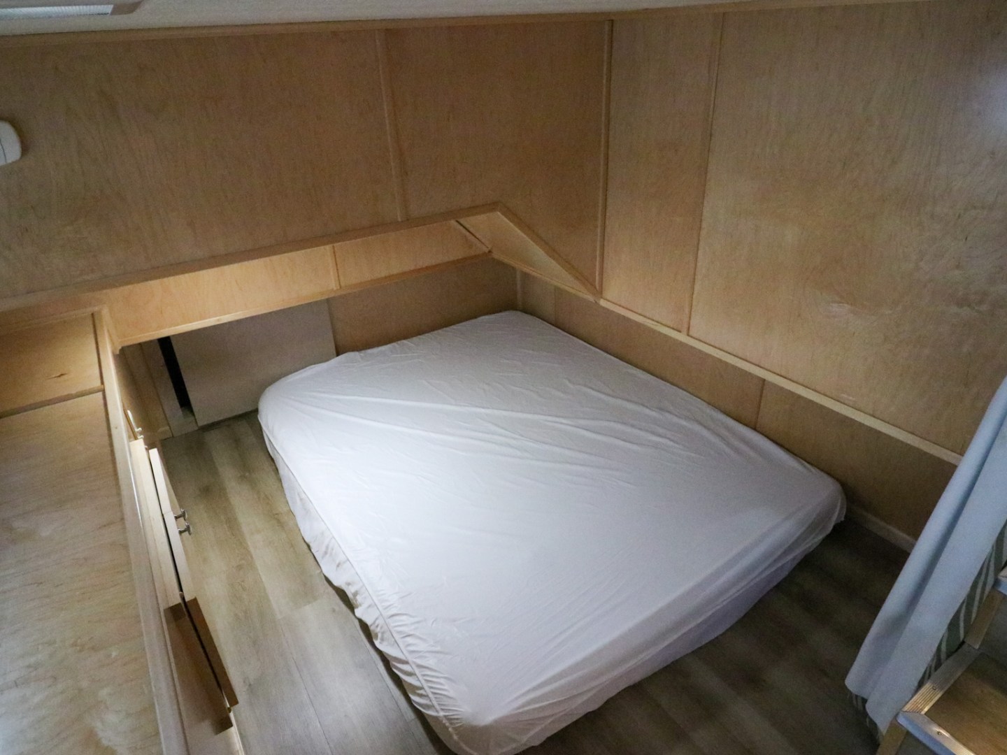 an empty bed in a room