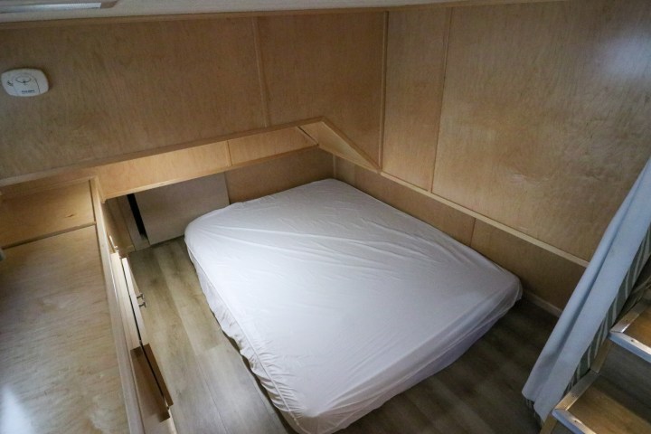 an empty bed in a room