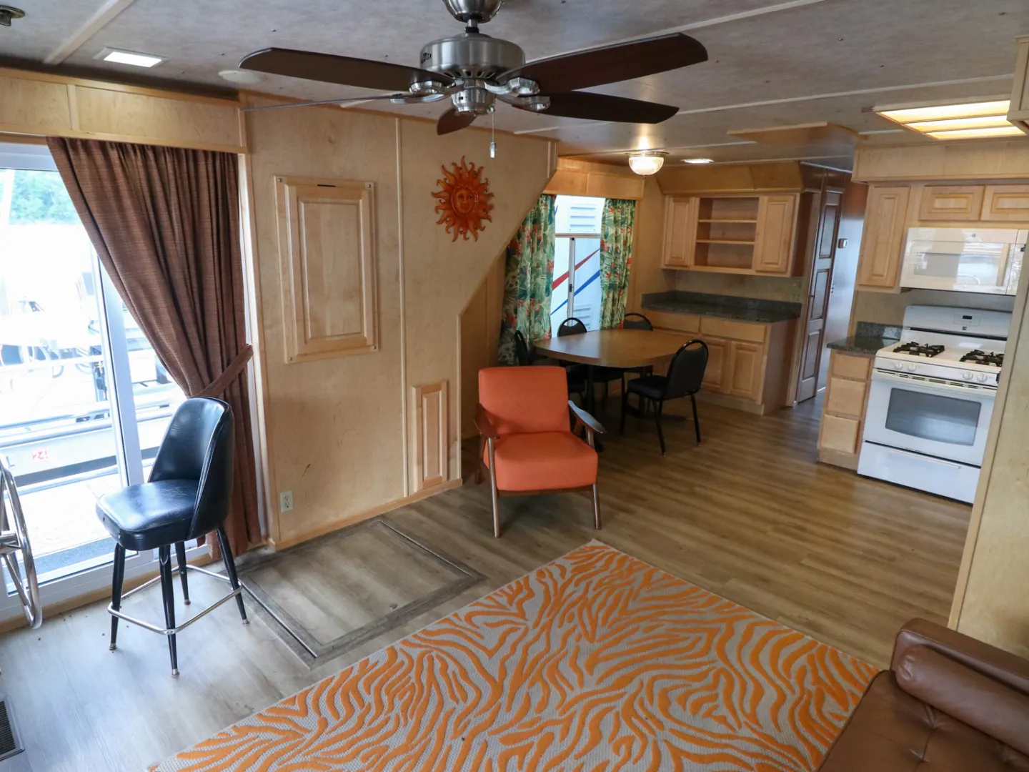 a living room filled with furniture and a fire place