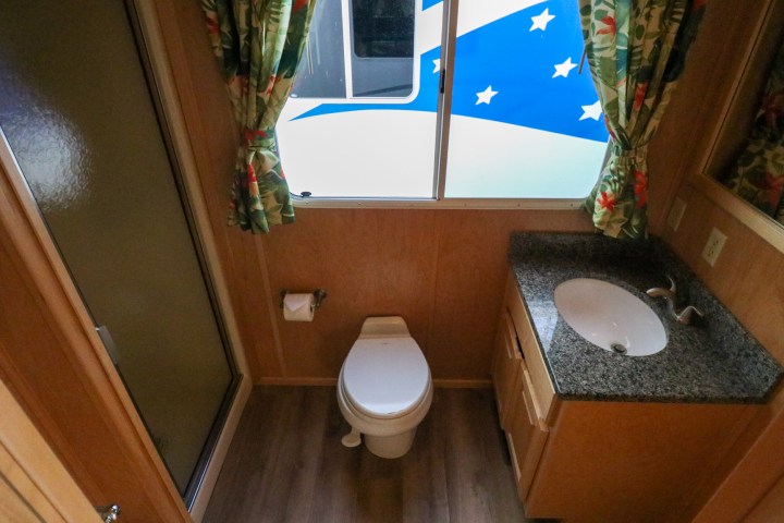 a room with a sink and a mirror