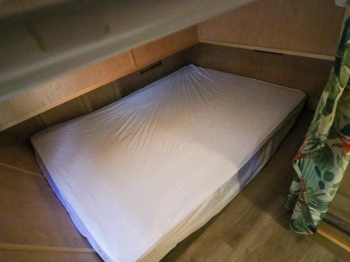 a bedroom with a bed and a table