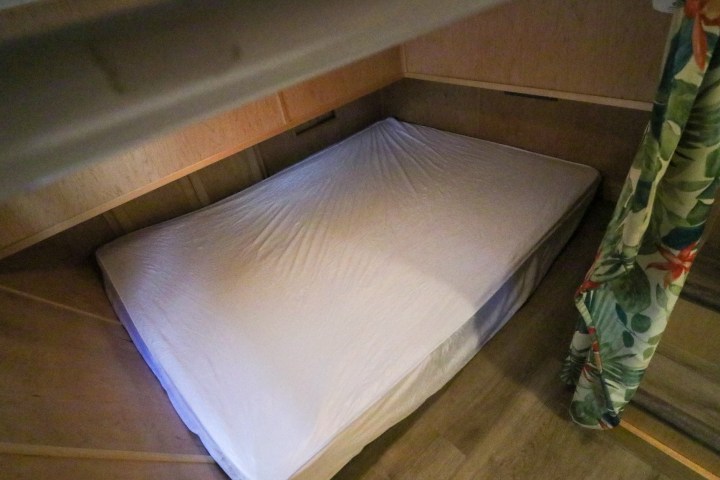 a bedroom with a bed and a table