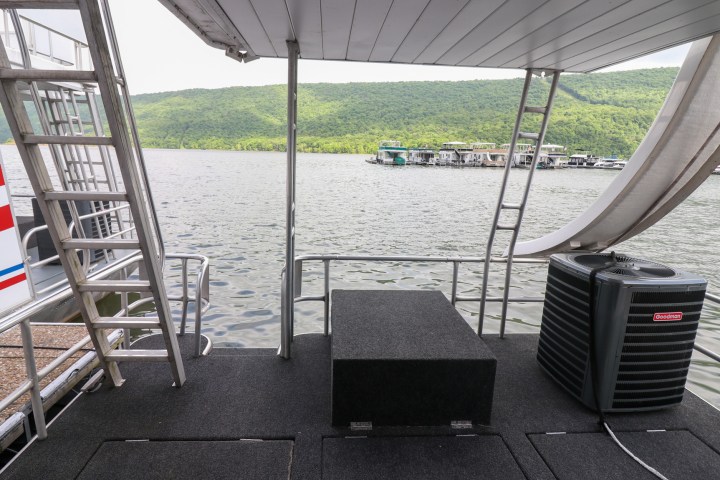 a boat sitting on top of a wooden chair