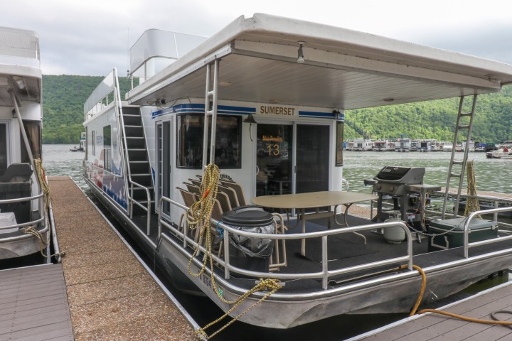 a train is parked on the side of a building