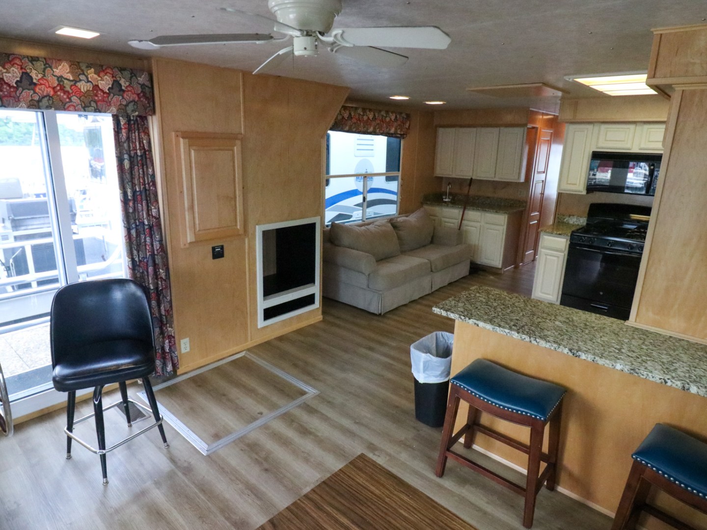 a living room filled with furniture and a fireplace