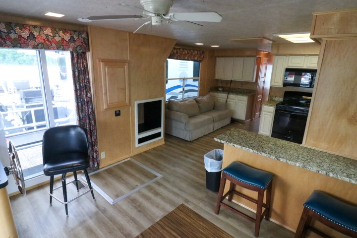 a living room filled with furniture and a fireplace