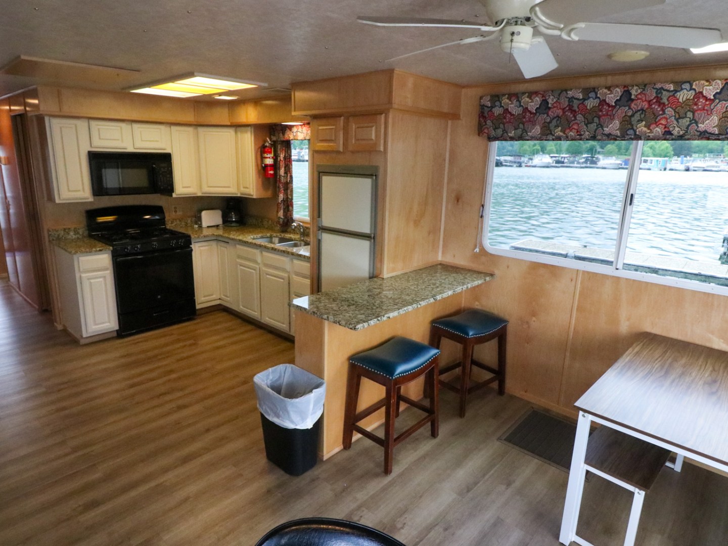 a kitchen with an island in the middle of a room