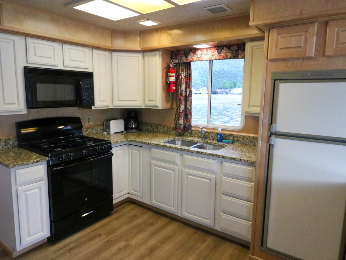 a kitchen with a stove top oven