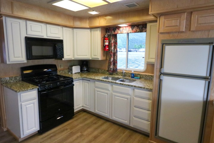 a kitchen with a stove top oven